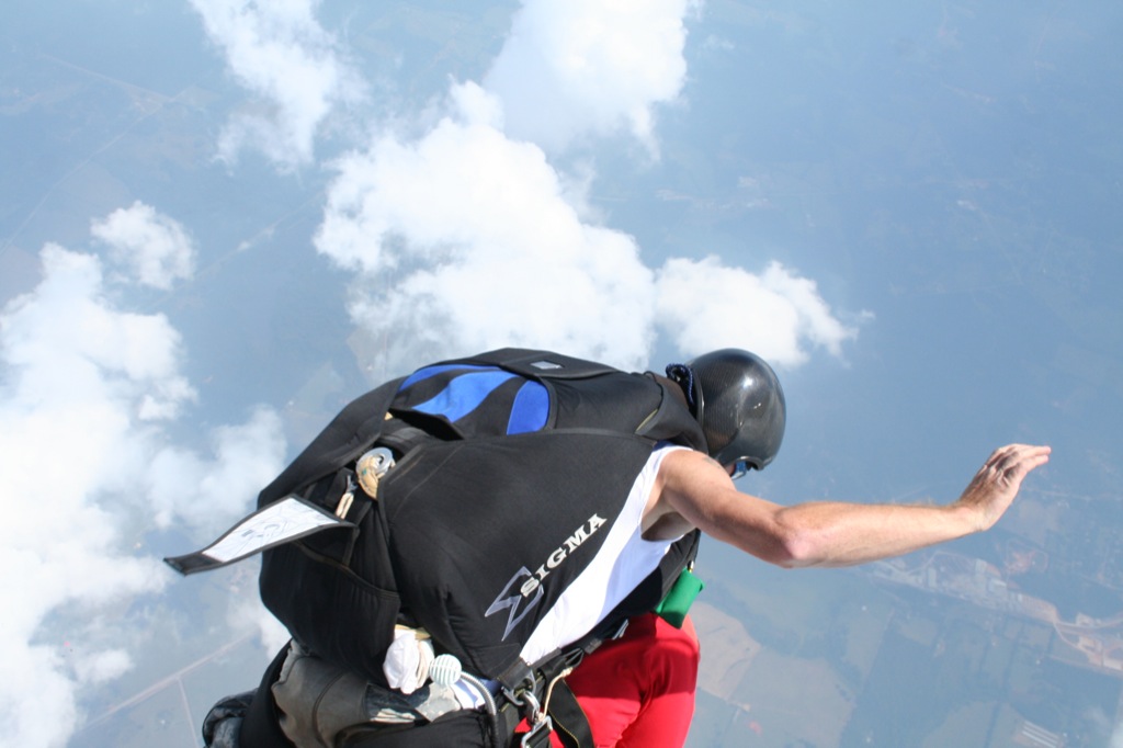 a man in black jacket flying through the air