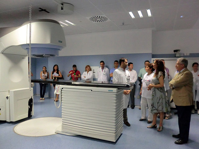 people looking at a model in a lab area