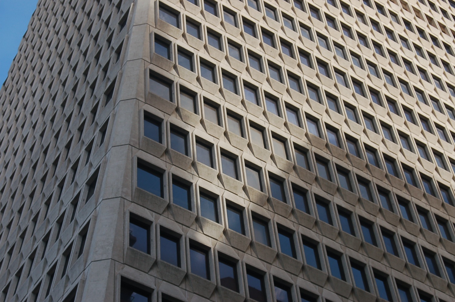 a tall building that has a clock on the outside