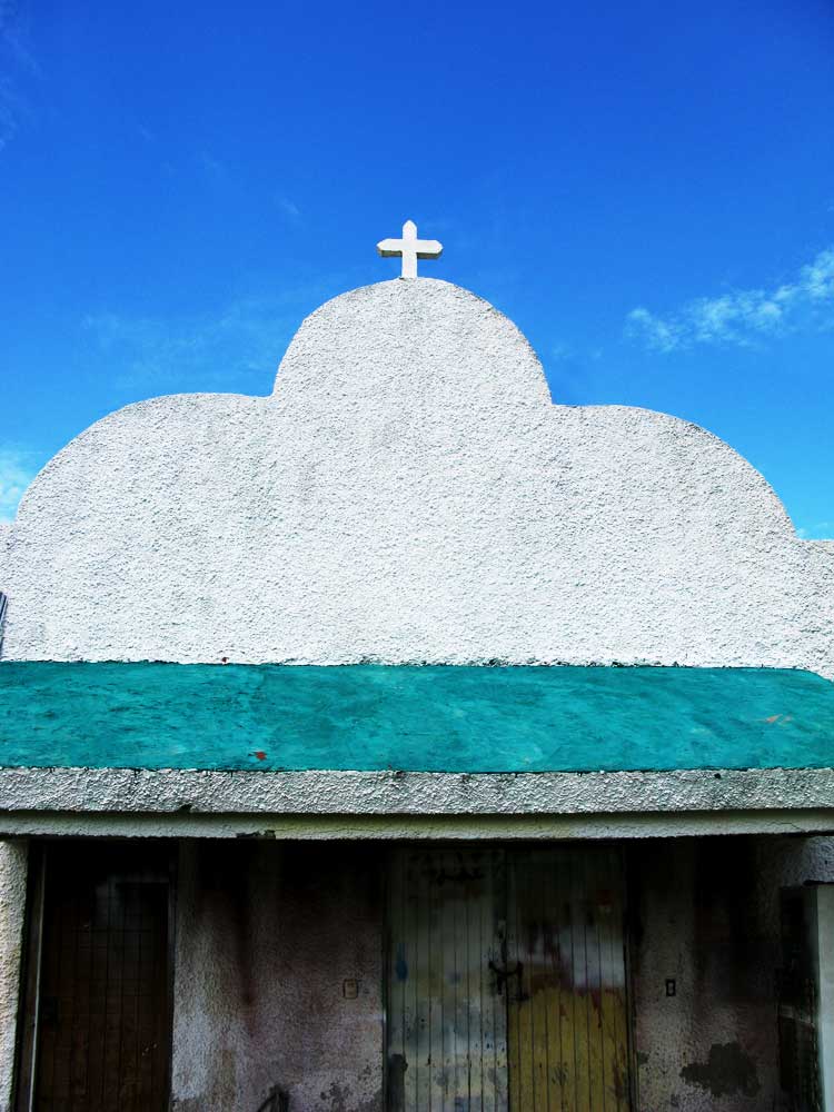 the roof and green tarp cover the entrance to a building