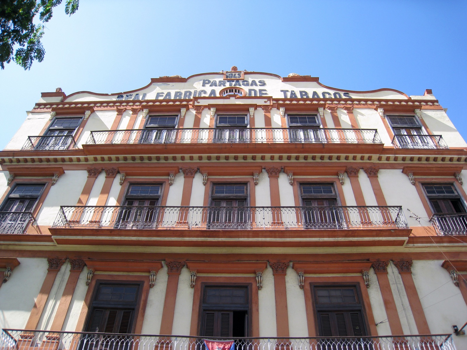 the front of the building has balconies and balcony railings