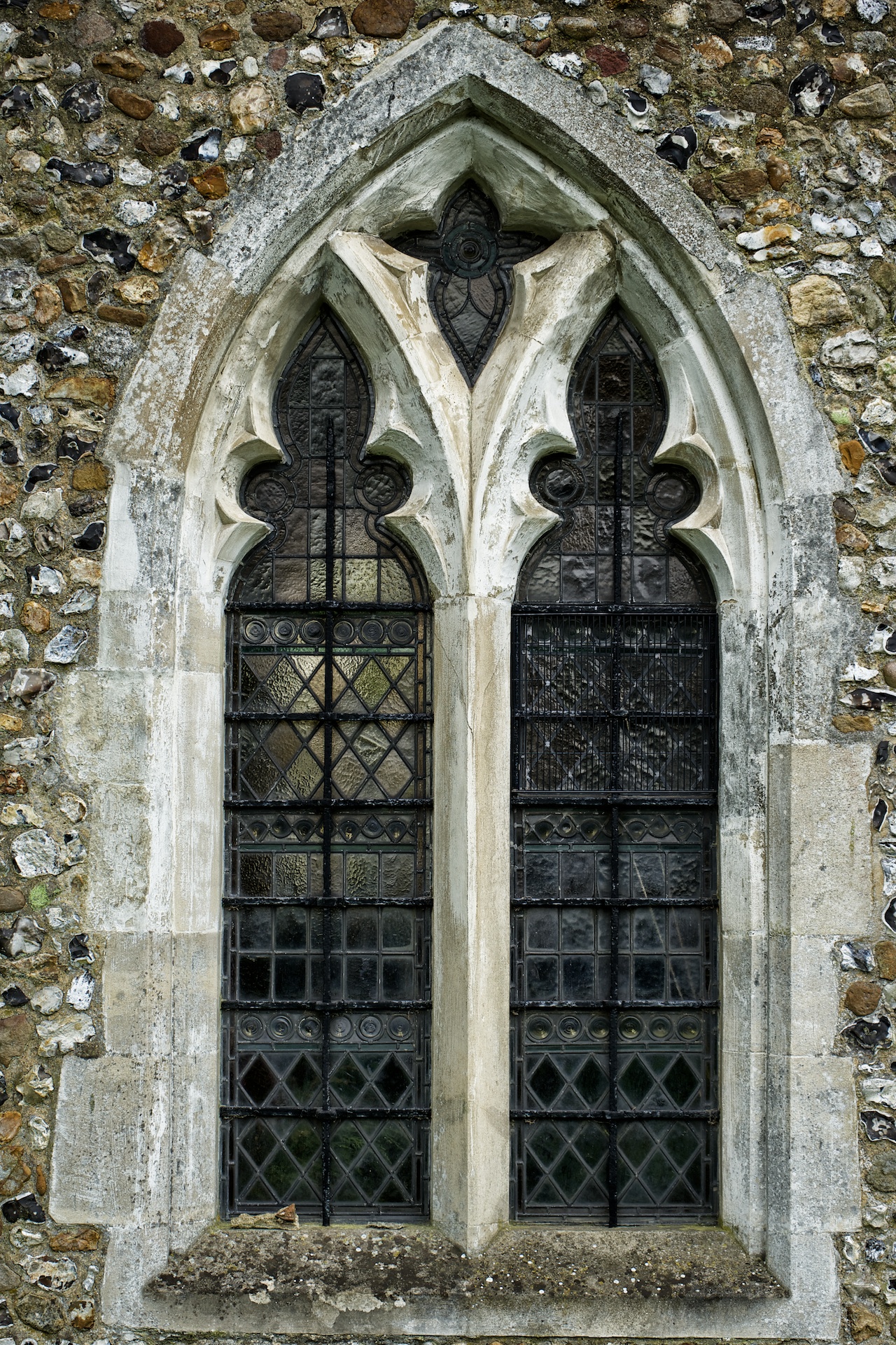 the gothic architecture of an old church windows