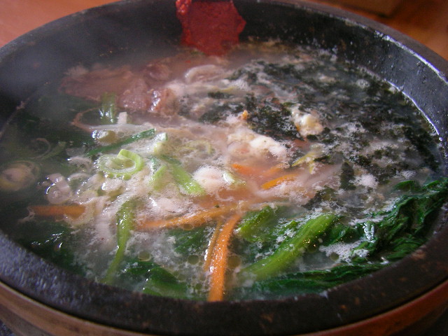 vegetables cooking in a pot on a stove