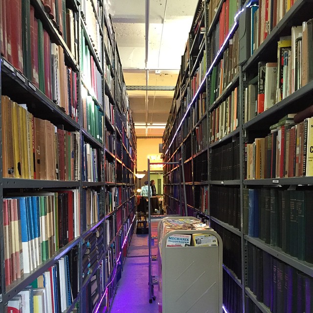 a po in the liry with various books on shelves