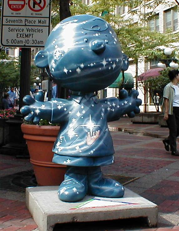 a statue on the street of a character