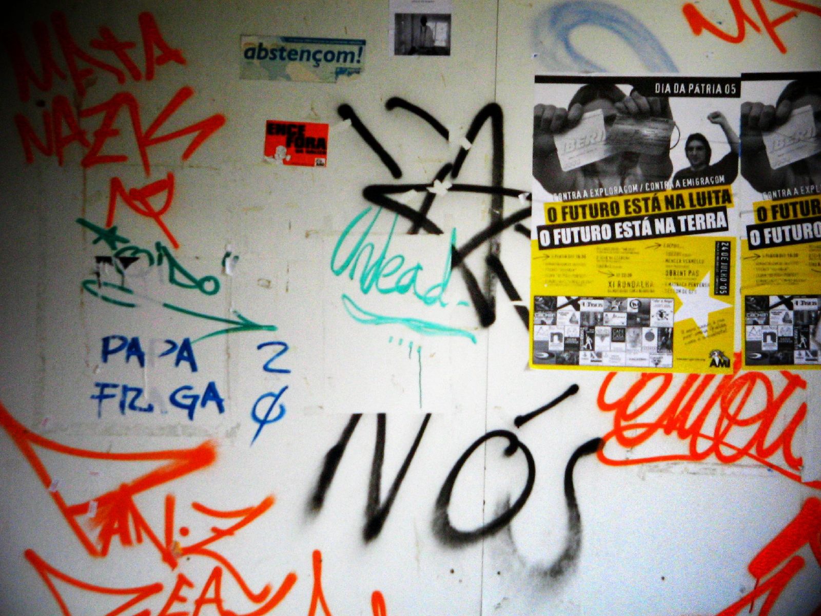graffiti on the walls shows various signs and symbols