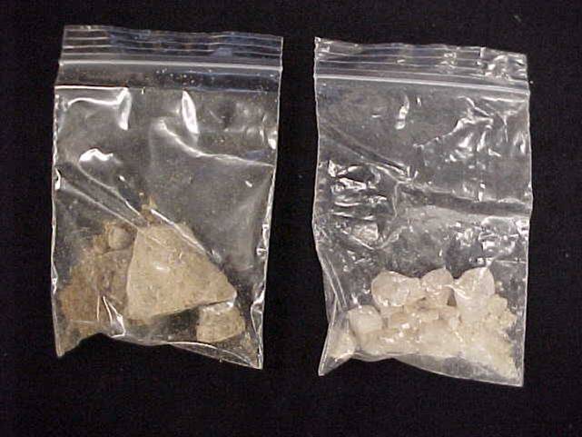 two bags with rocks in them on a table