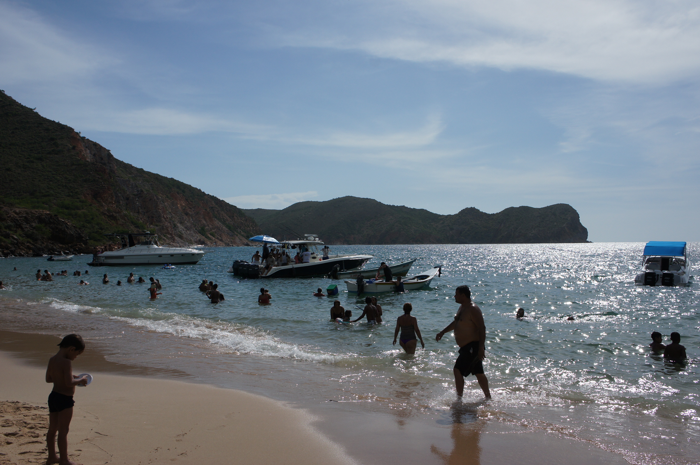 a group of people enjoying their time at the beach