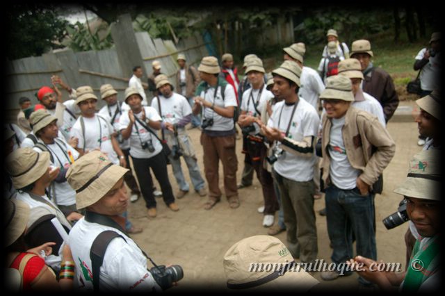 a group of people with camera and hats