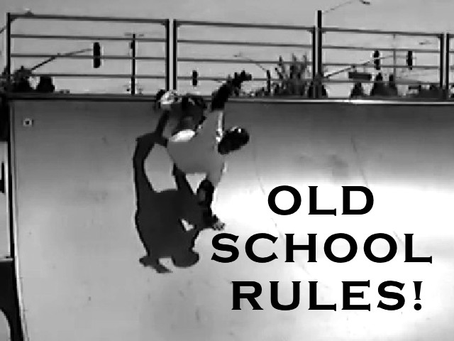 a skateboarder in white shirt riding a ramp with words old school rules