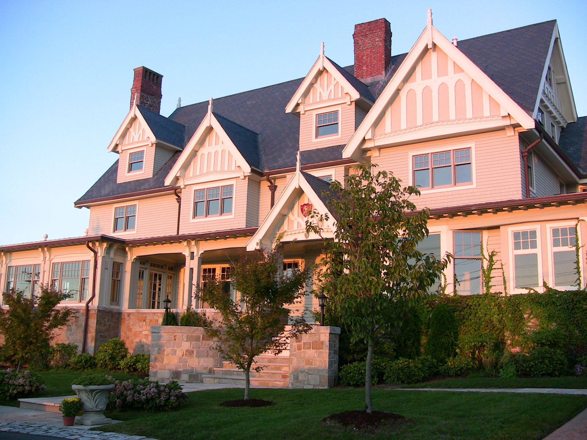 a four story house with a steeple and roof