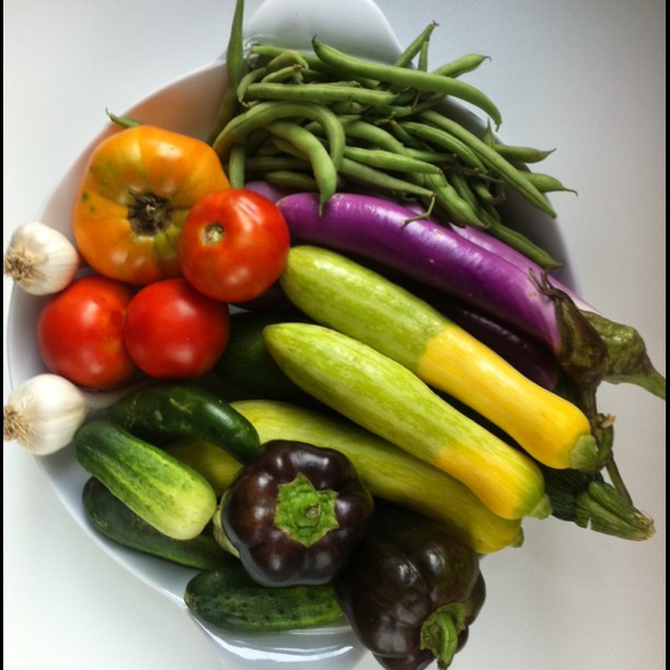 various fruits and vegetables laid out in a bowl