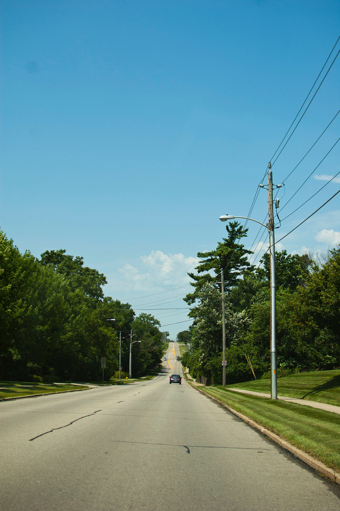 a large long road with lots of power lines