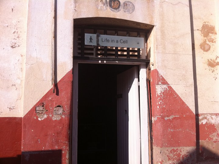 an entrance to a building with a sign on the door