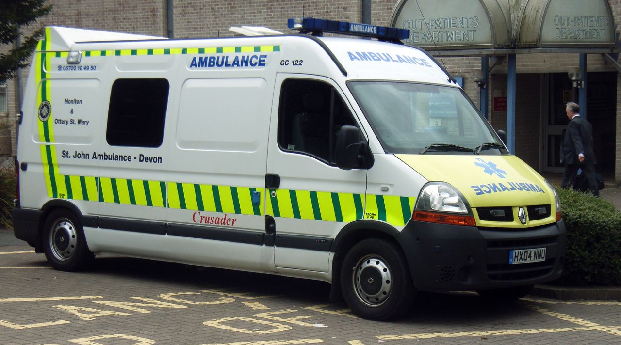 an ambulance parked in front of a medical building