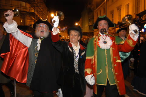 people in costume standing on a street