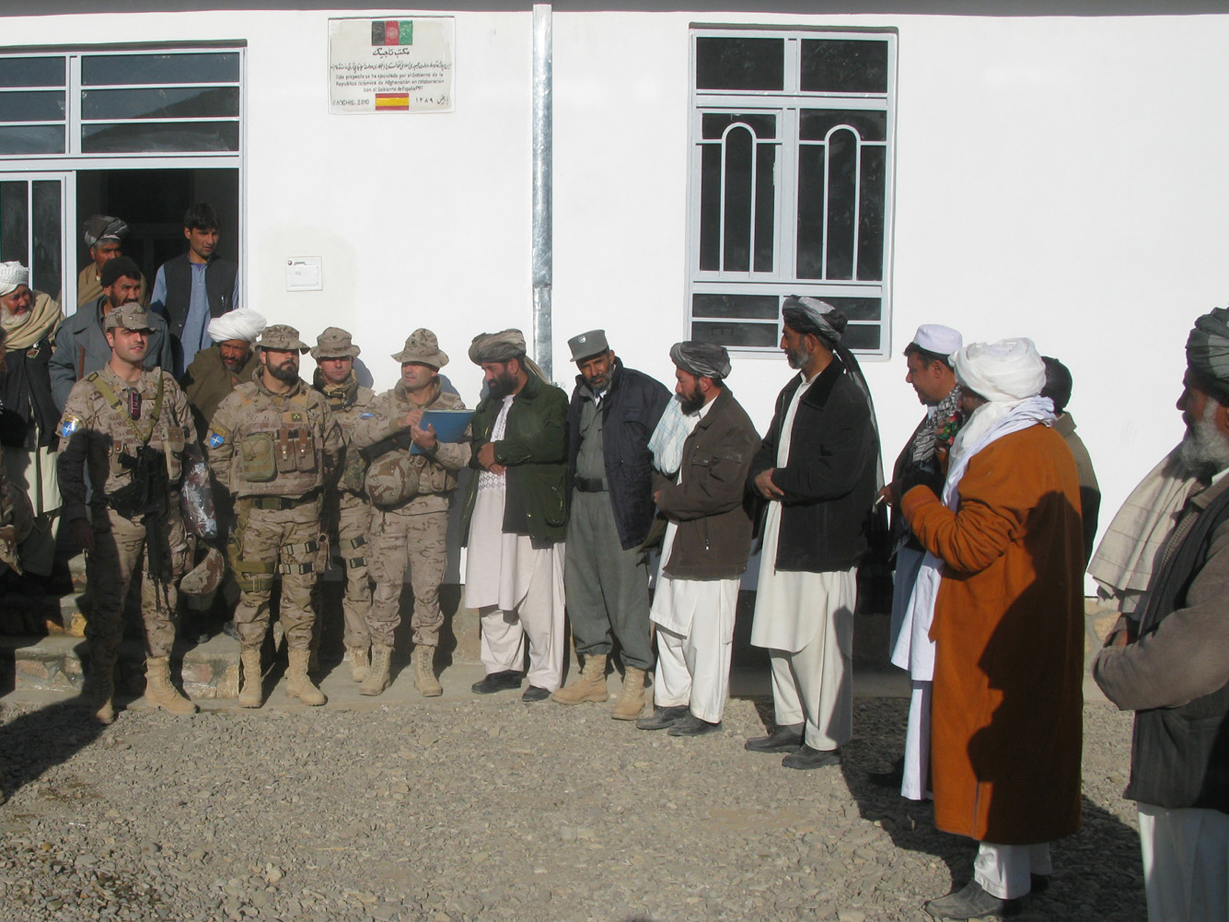 a group of people standing outside a building