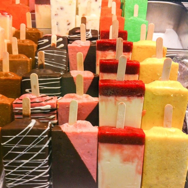 a selection of colorful candy pops sitting next to each other