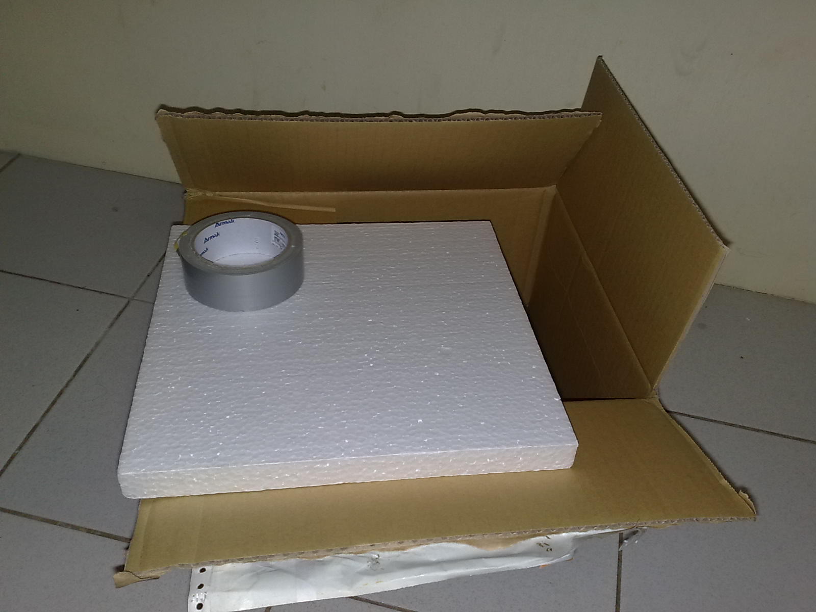 a cardboard box with a closed top on it