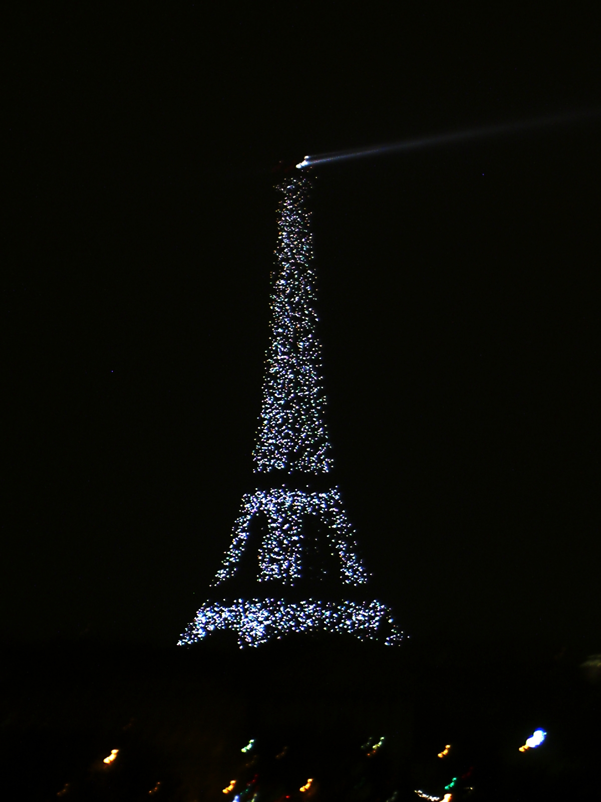 a picture of the eiffel tower lit up at night