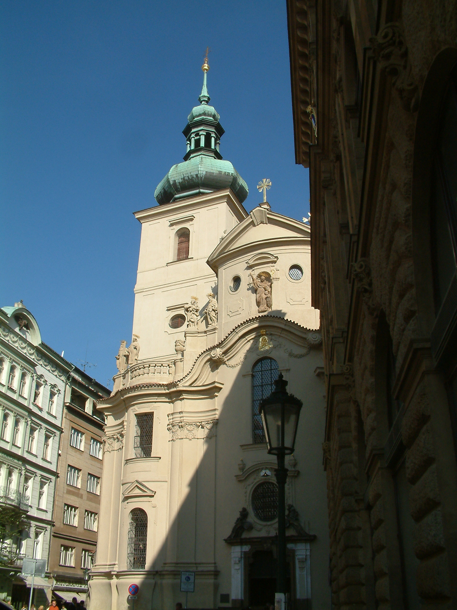 the front of an old church with a green steeple