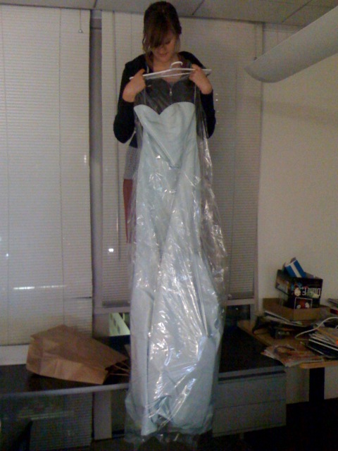 a woman in a plastic bag that looks like a dress