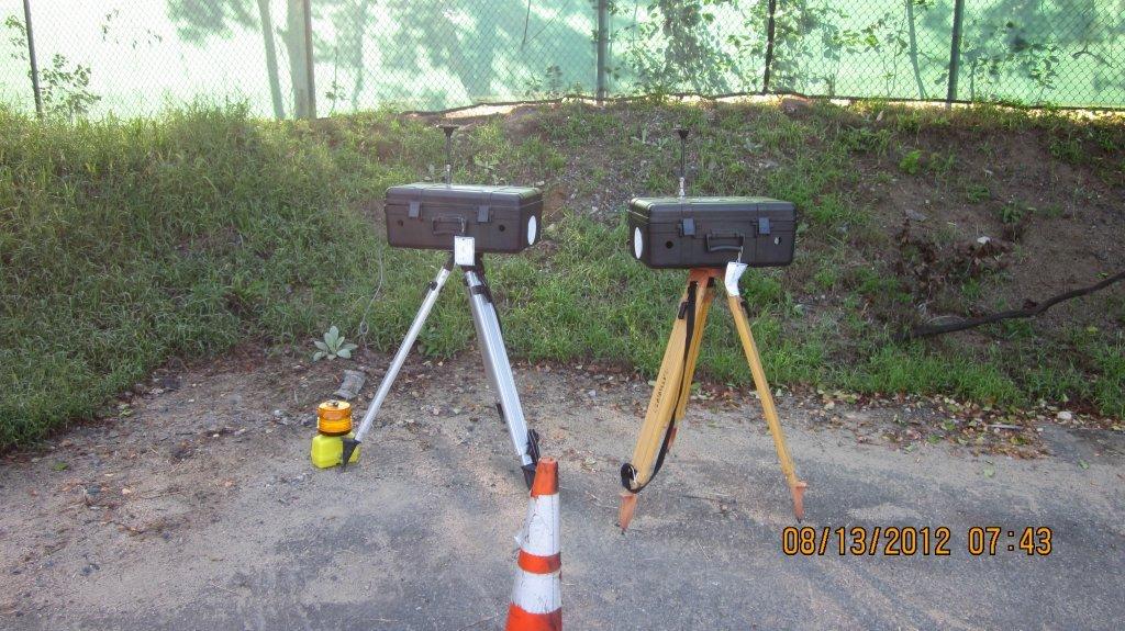 two camera sets on a tripod at an overlook