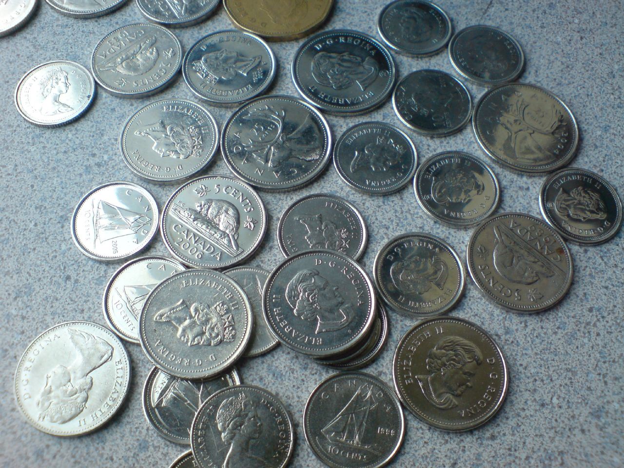 an array of different coins sitting on a table