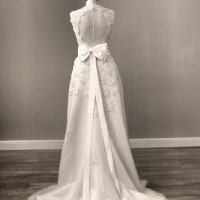 the back view of the wedding gown from the side