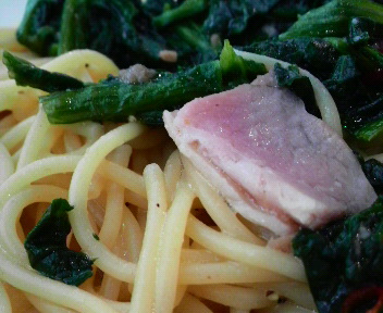 a close - up of a plate of food that includes pasta and vegetables