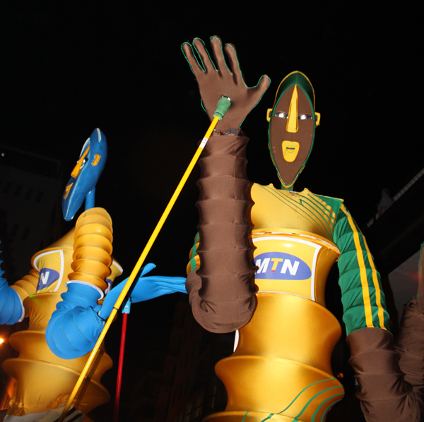 several costumes are being worn on a parade