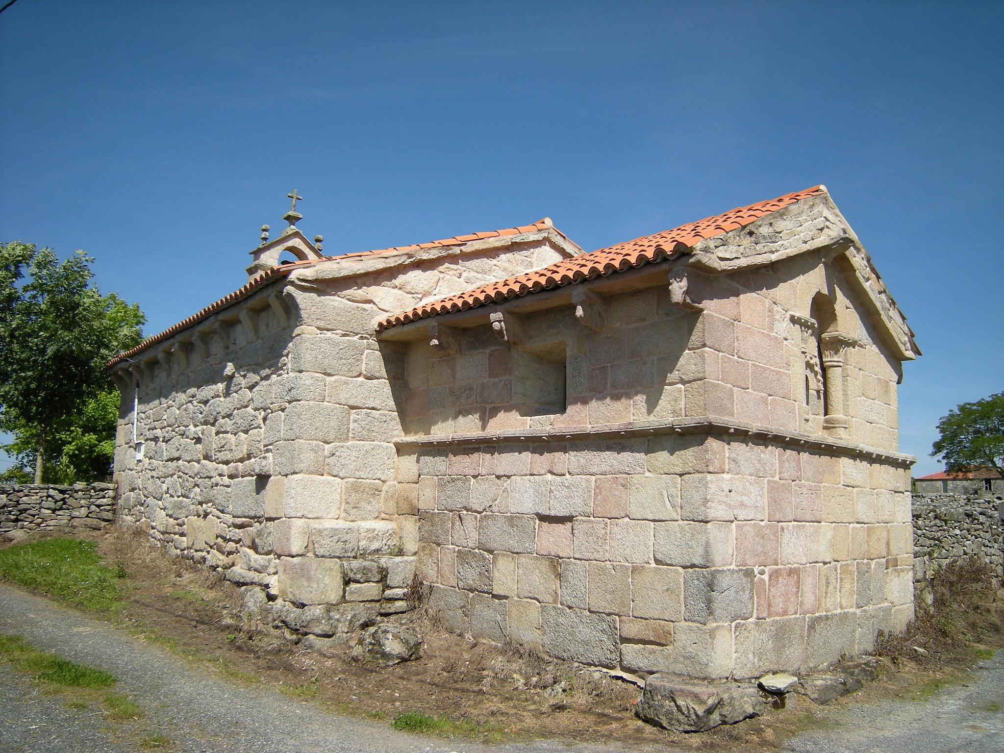 a stone structure with two small windows