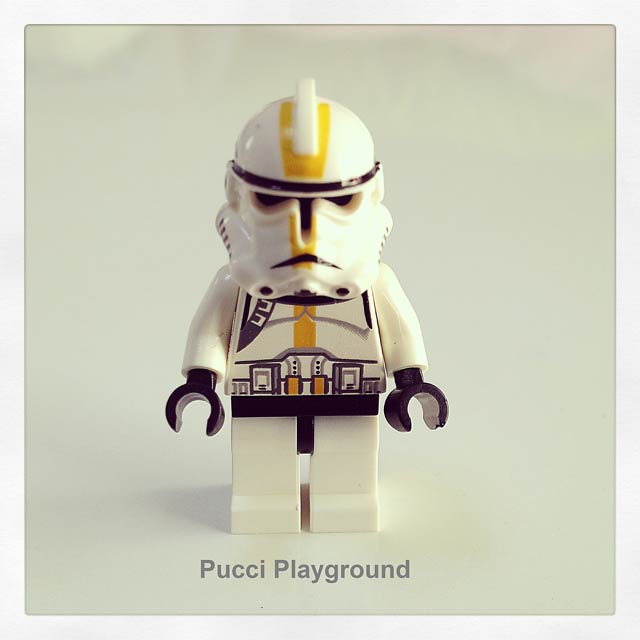 lego star wars character with helmet and yellow hair