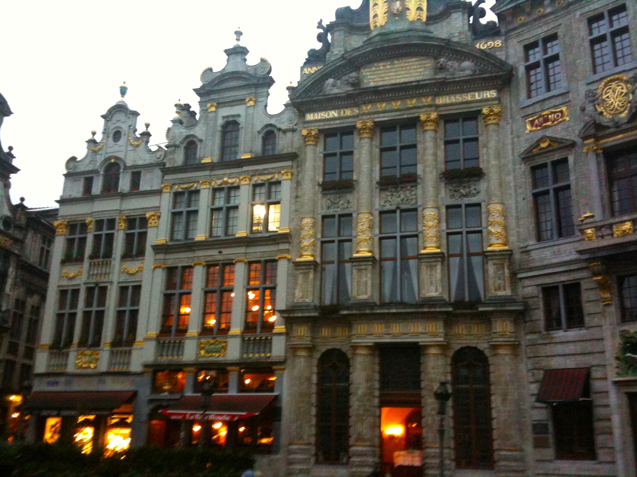 some fancy buildings with ornate architectural details at night