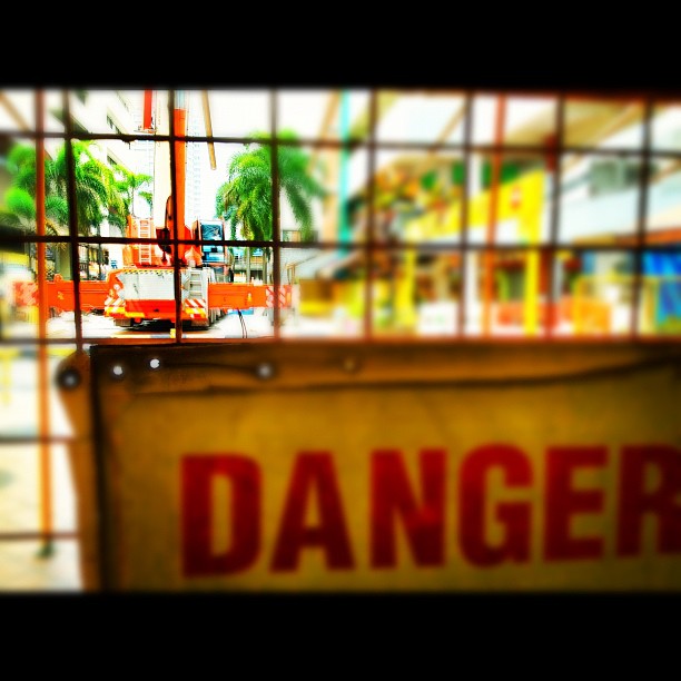 there is a danger sign near a window