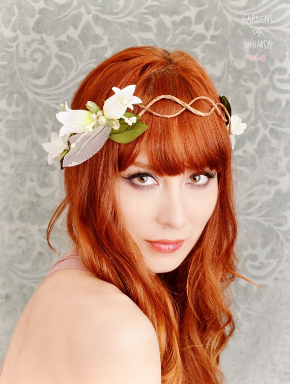 young red haired woman with flower in hair