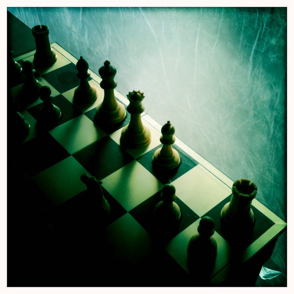 two pawns placed on top of a chessboard