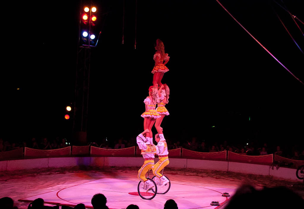 circus act performed in large open area at nighttime