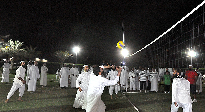 people at an event playing volley ball together