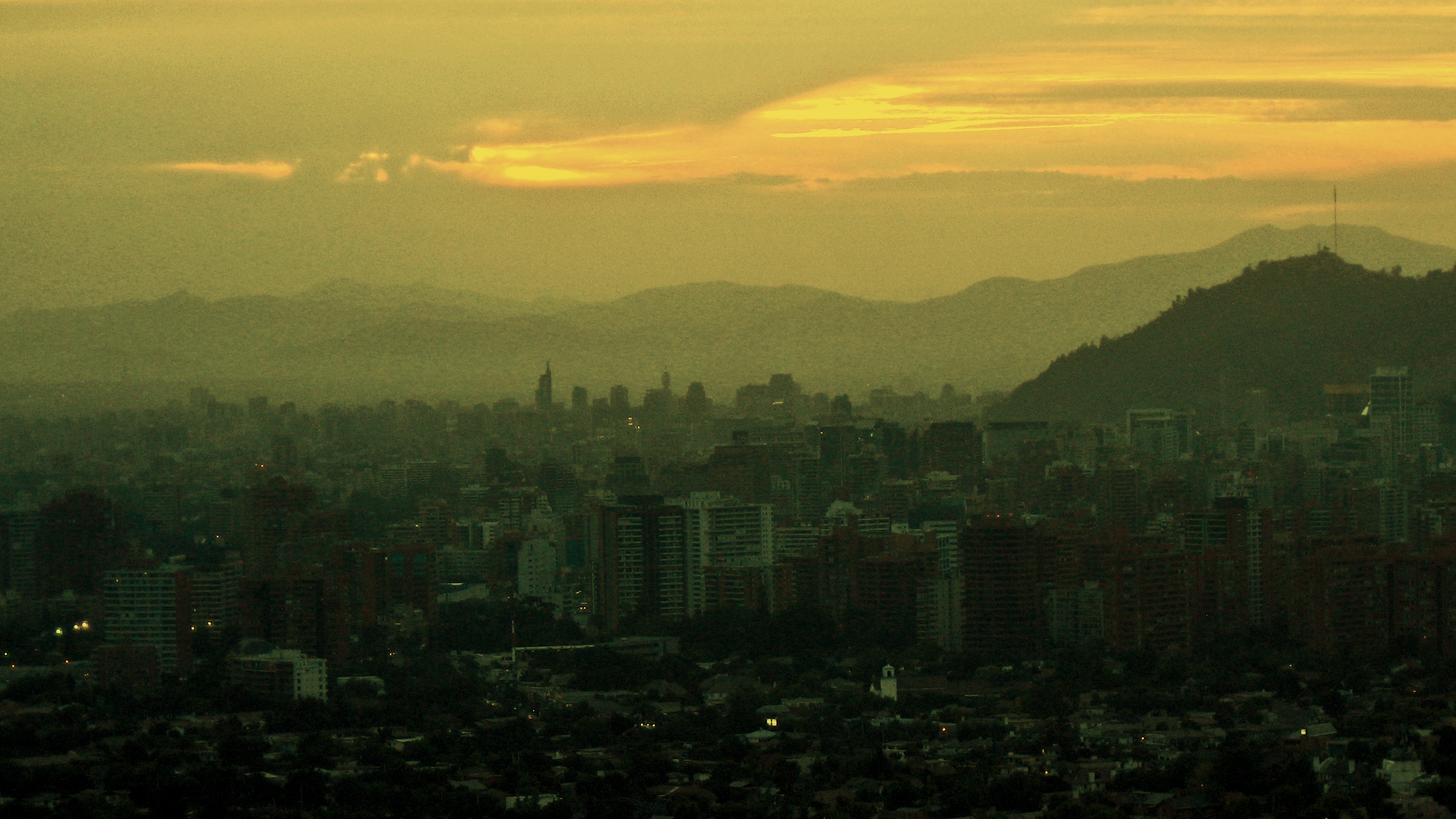 this is the view of a city at sunset