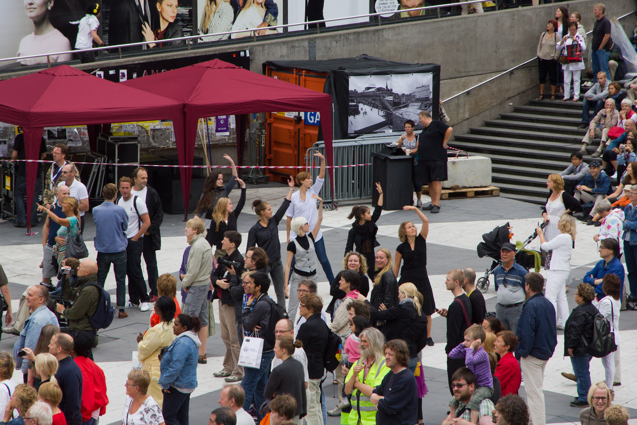 a crowd of people are gathered around a movie