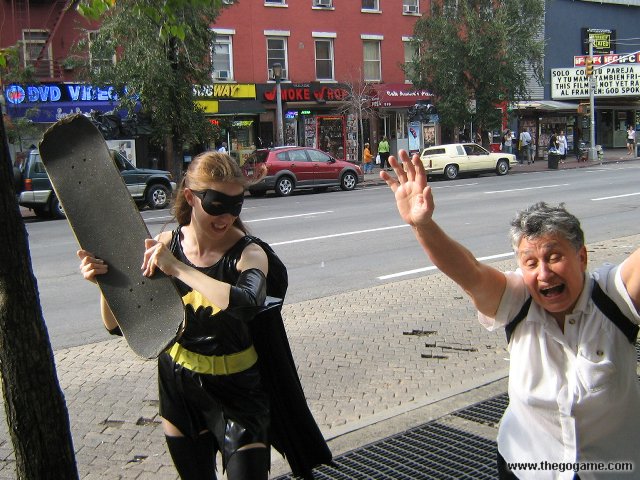 two people in costumes standing on a city street