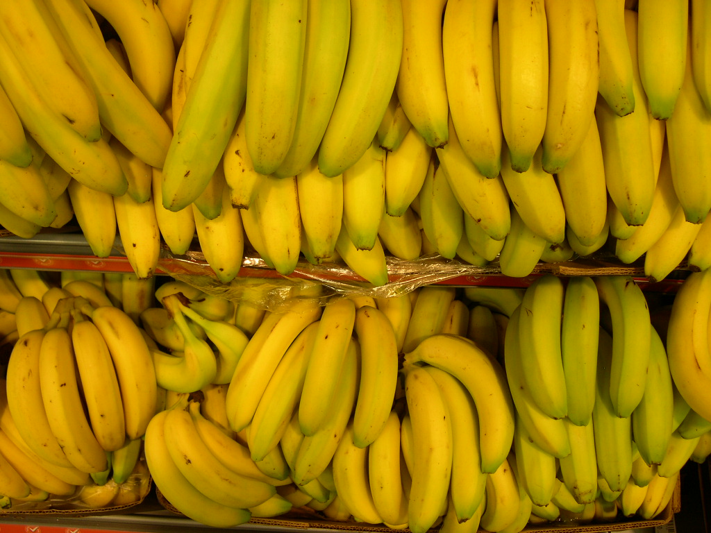 bunches of bananas are arranged in piles