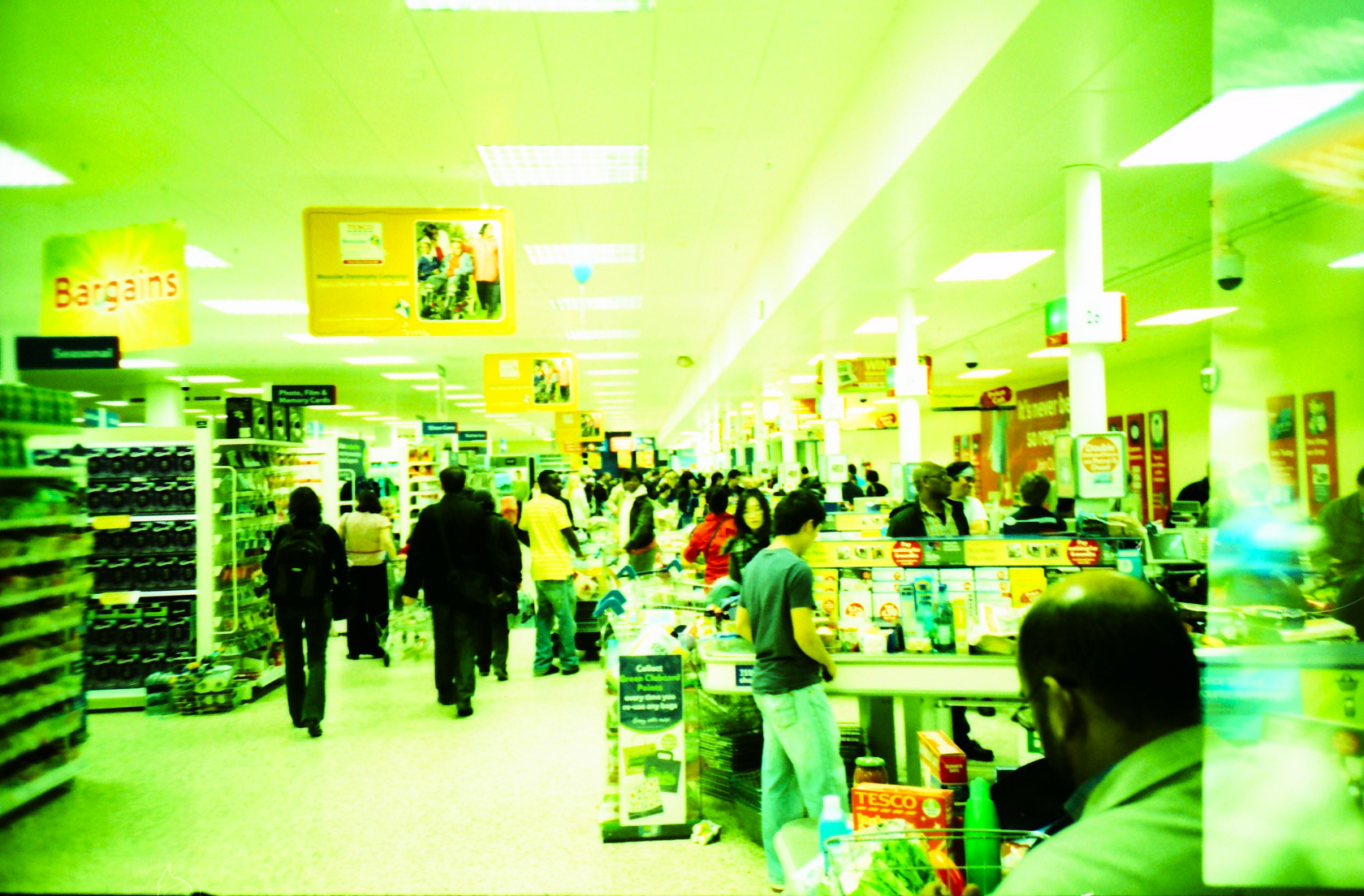 people in a bookstore looking through books on shelves