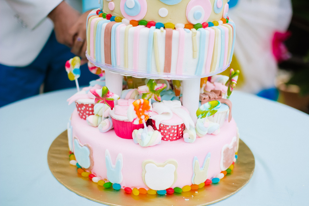 a two layer cake is decorated with candy and candies