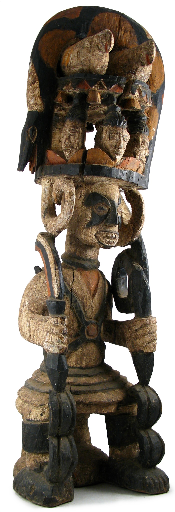 a piece of wood sculpture, with various items in it