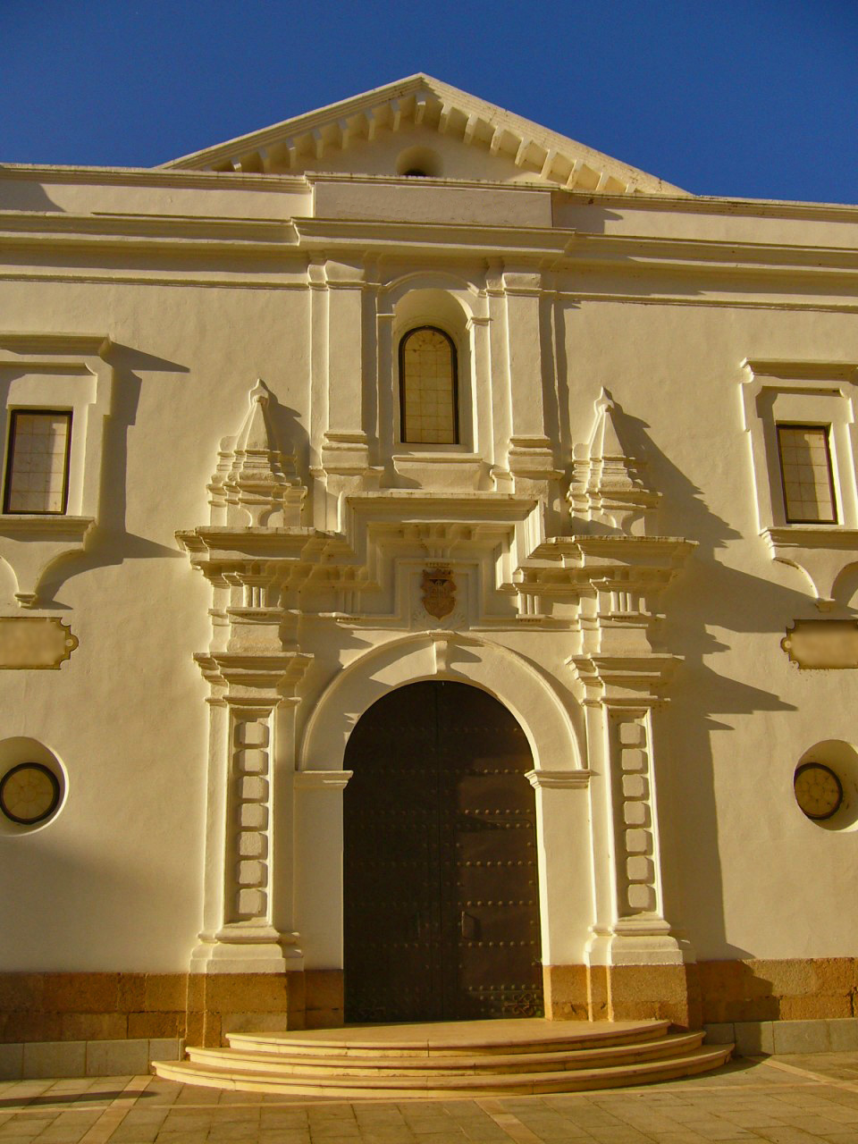 a large white building with a big doorway