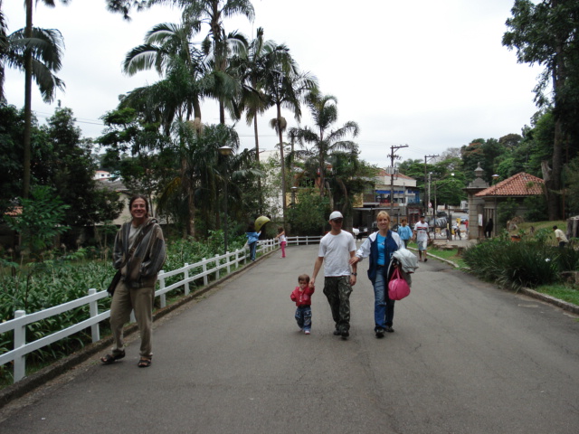 a group of people walk down a paved path