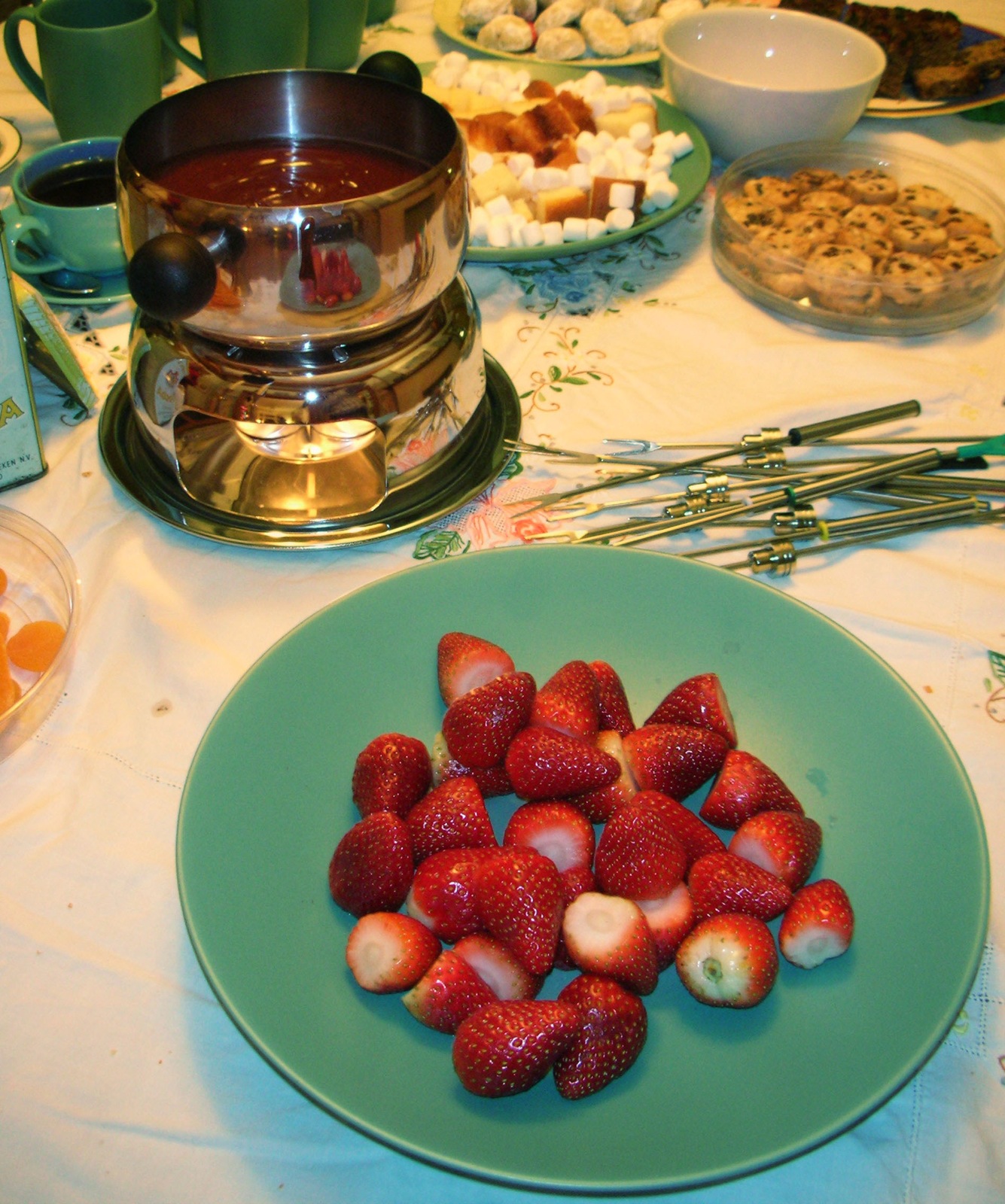 a table topped with plates and bowls filled with food