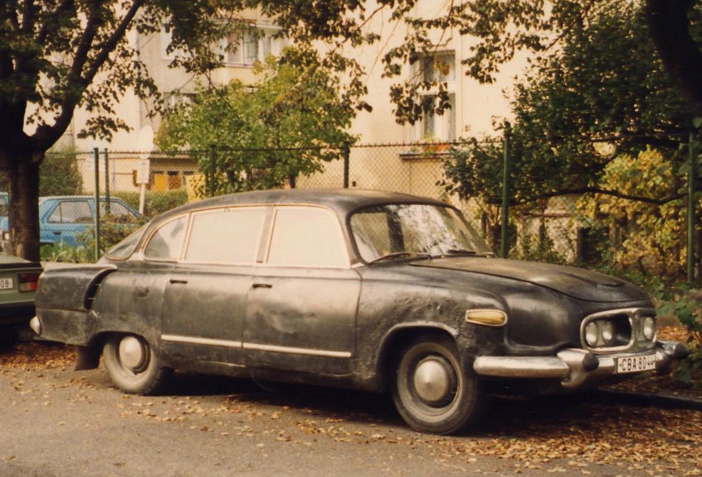 old fashioned car that is in some kind of accident